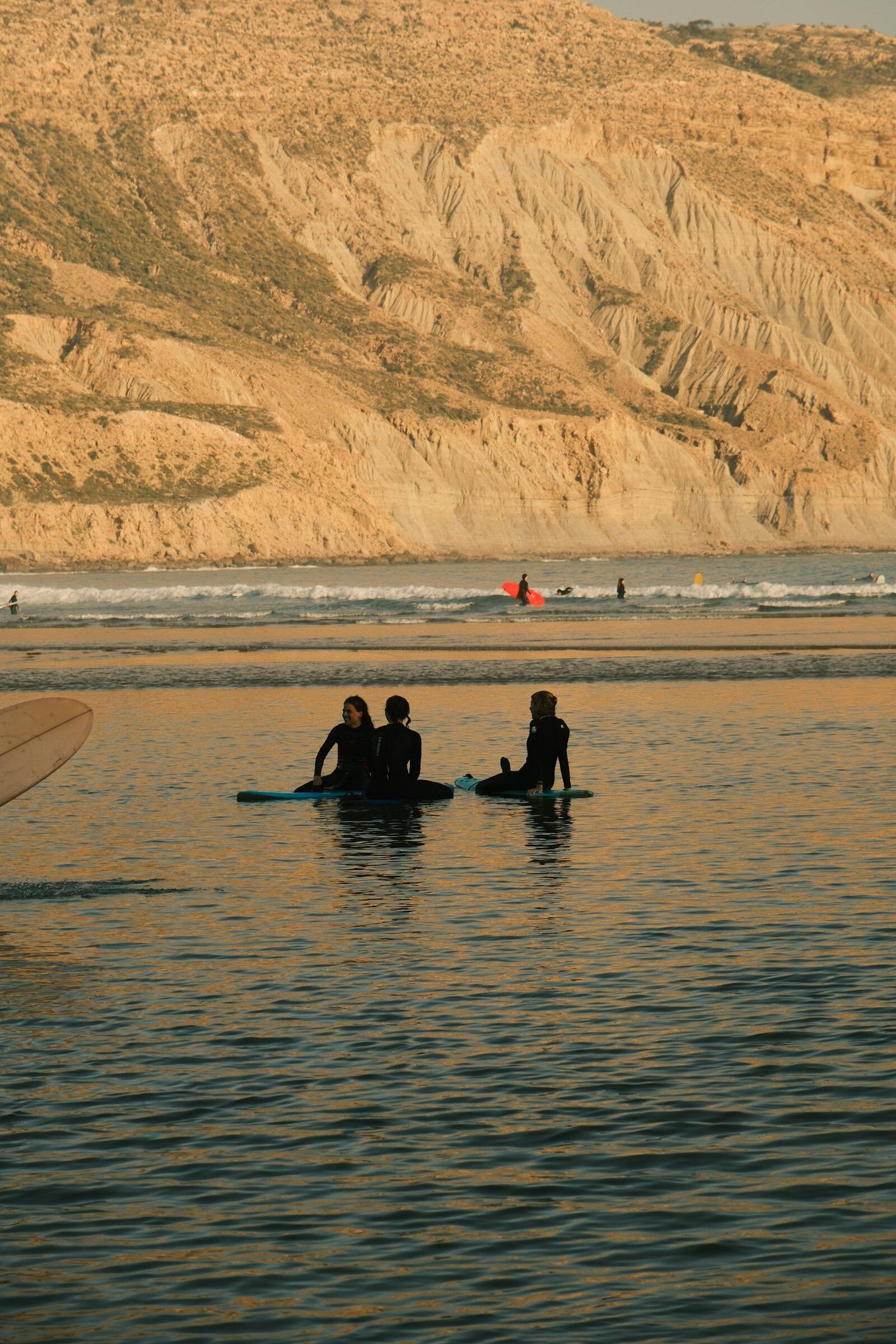 Surfers in the Taghazout lineup, Morocco