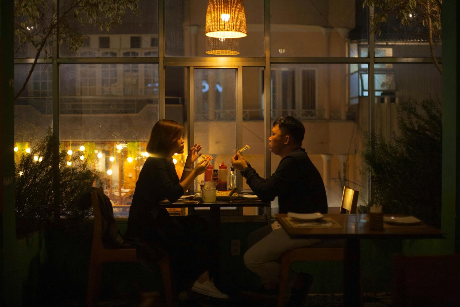 Documentary couple dining candidly at a restaurant table