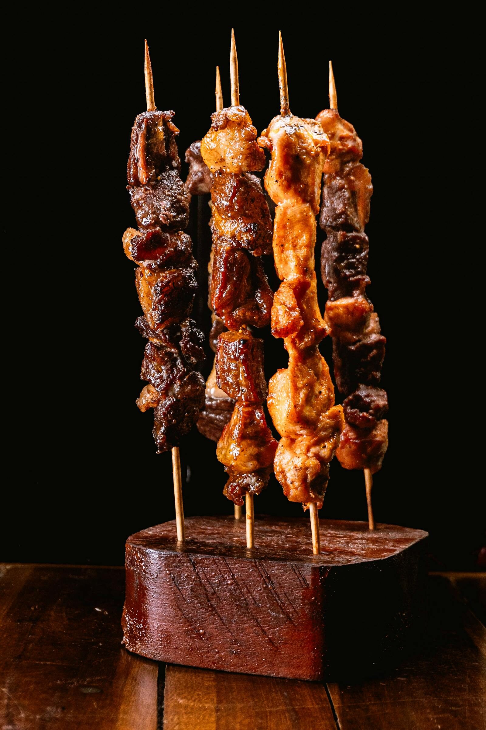 Mechoui-style grilled meats on charcoal, traditional Moroccan presentation