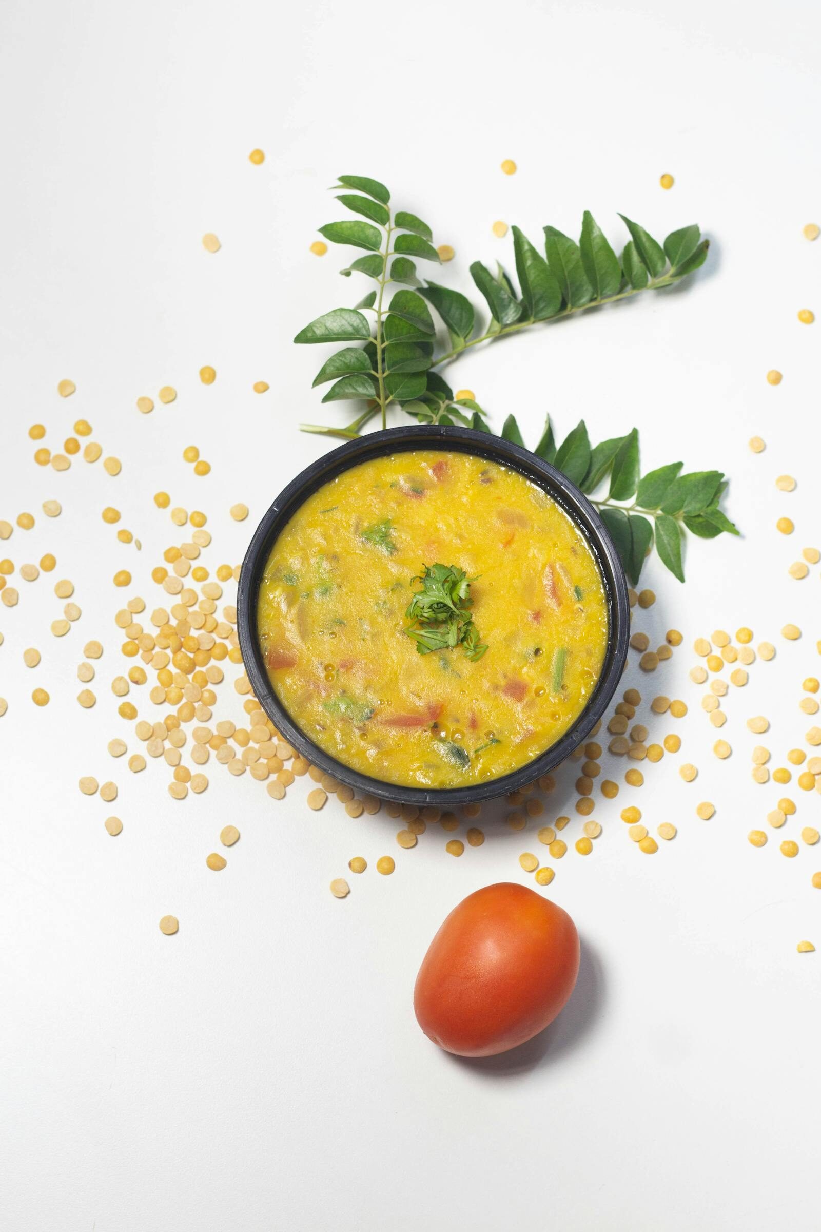 Moroccan harira soup served in traditional bowl with dates