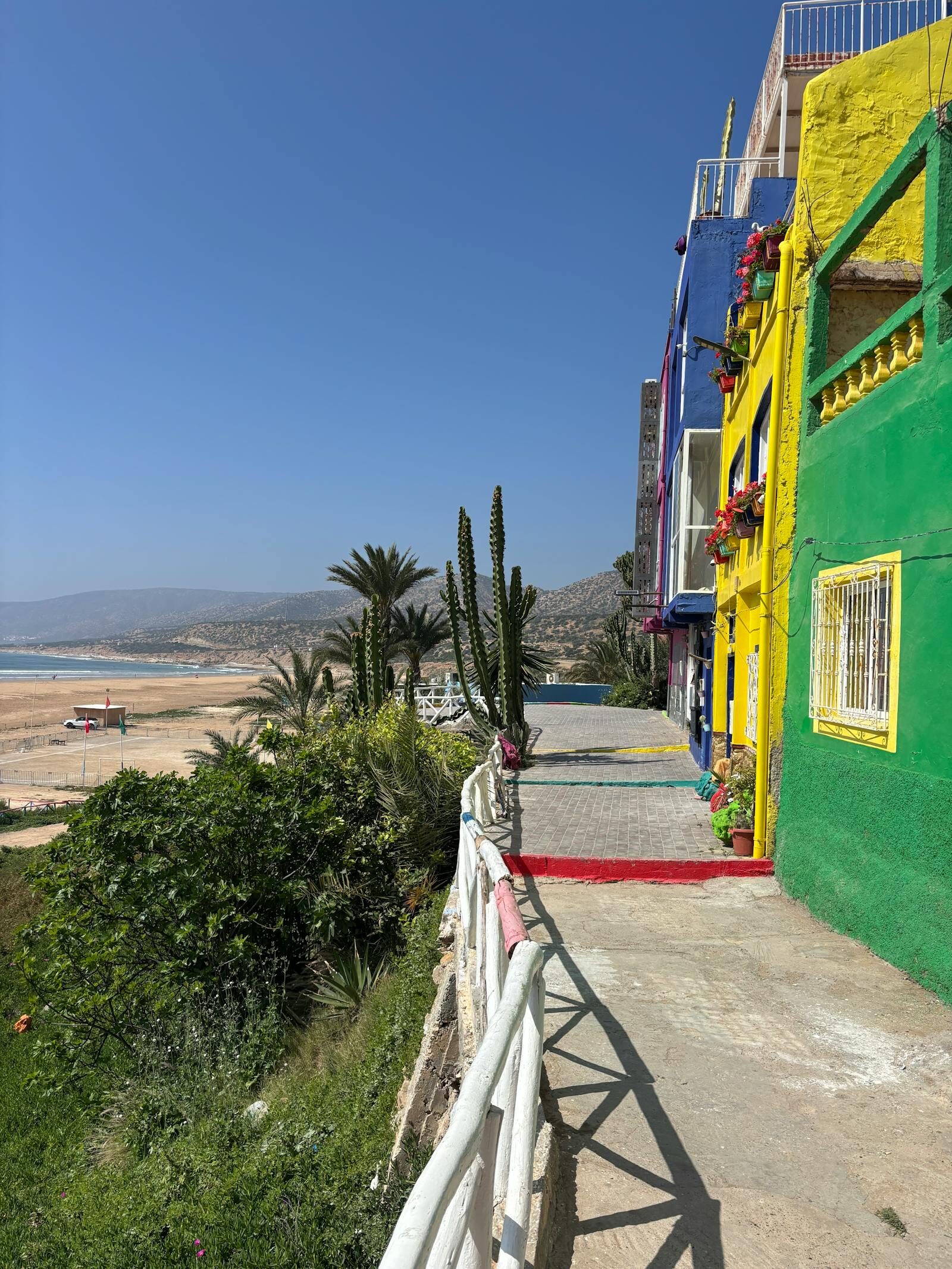 Vibrant beachfront promenade buildings under Agadir’s blue sky