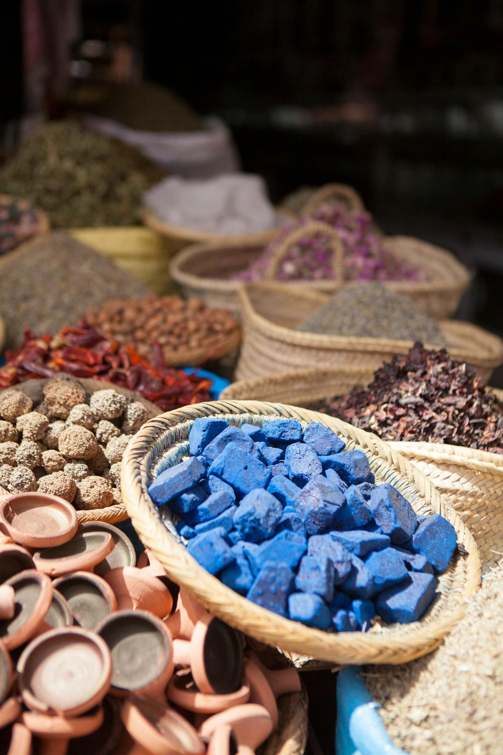 Moroccan spices including cumin, paprika and ras el hanout in conical piles — the seasoning base behind Restaurant Rafiq Agadir’s kitchen
