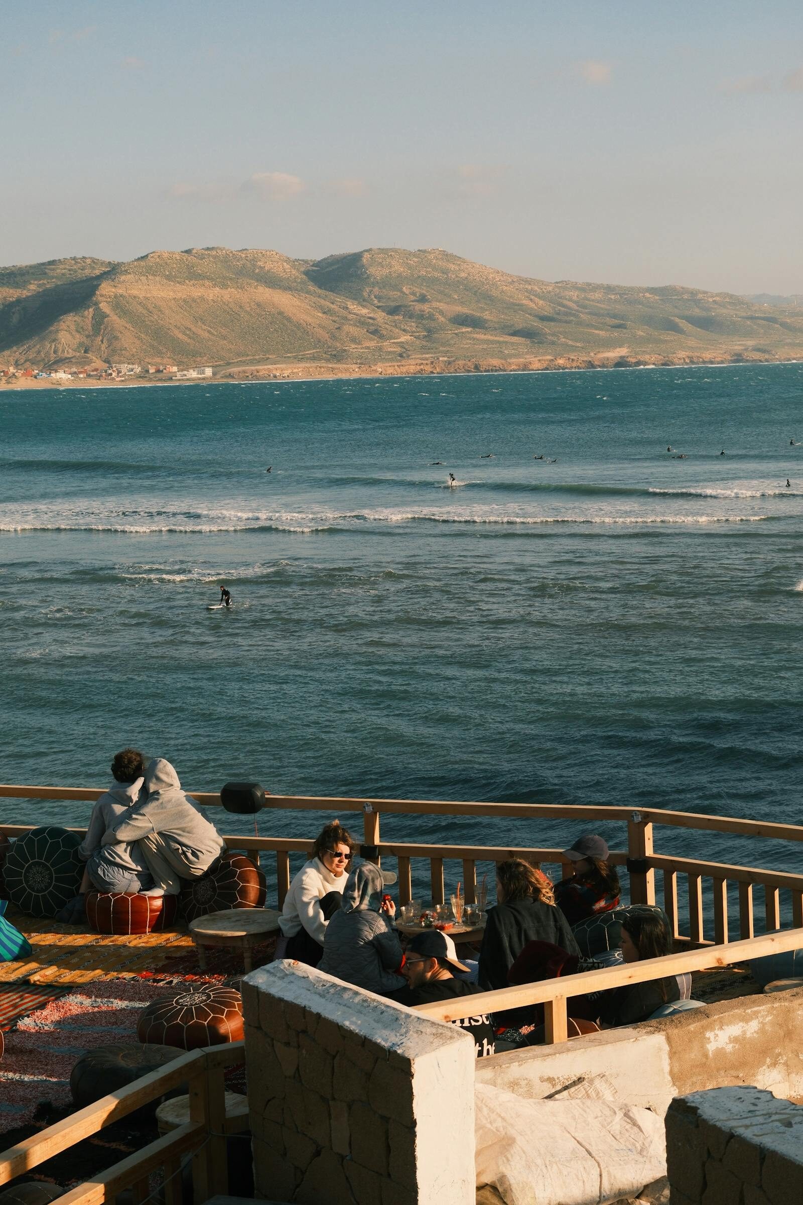 Coastal cafe terrace overlooking the ocean in a Moroccan surf village