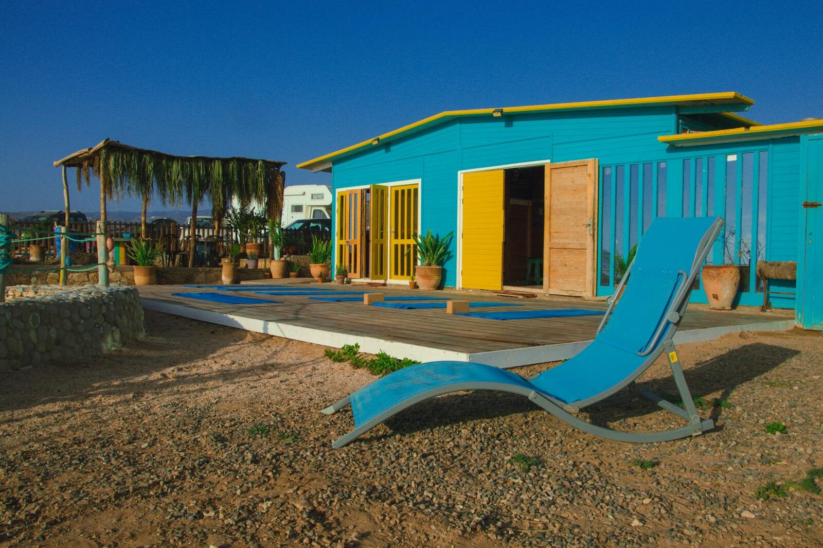 Colorful surf hostel terrace with seaside view in Morocco